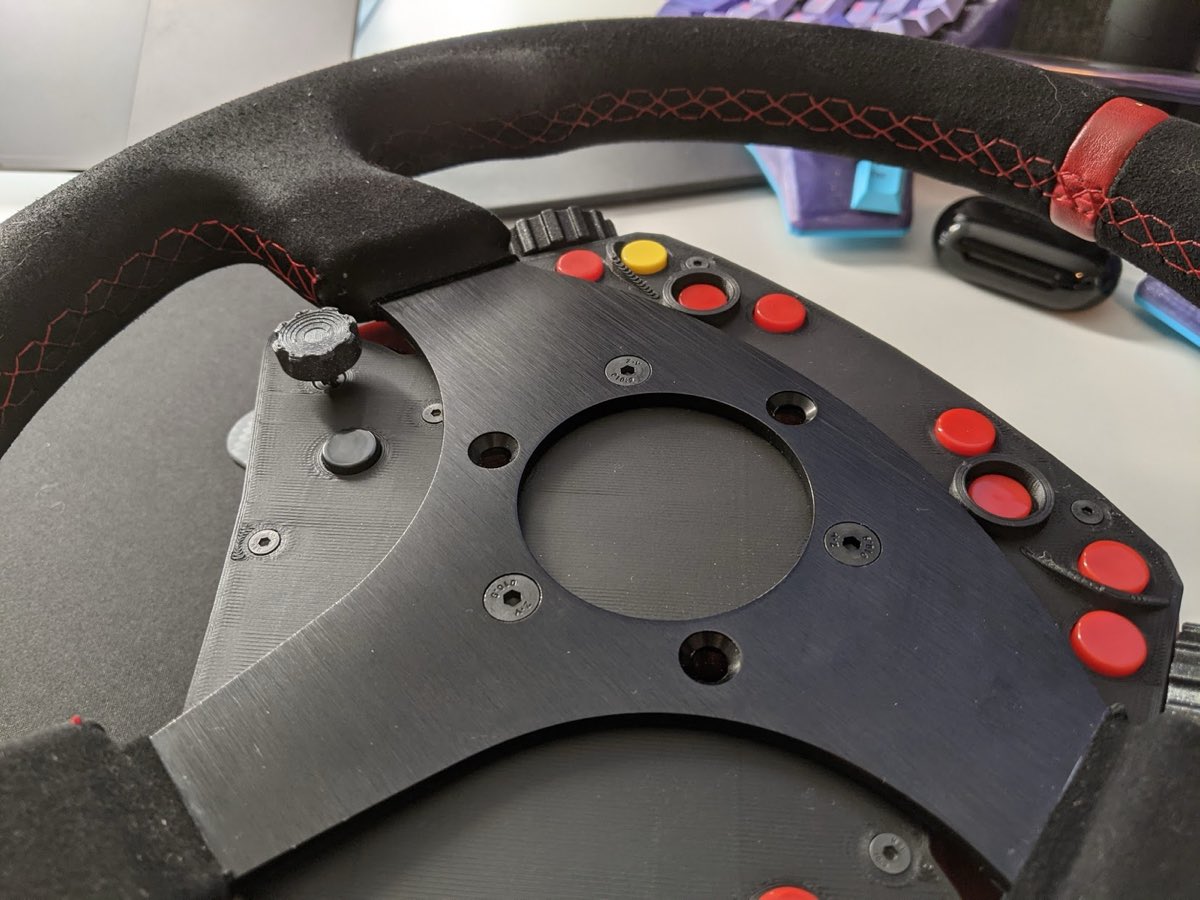 BLE Button Box mounted on the wheel, with countersunk M5 bolts replacing the horn retainer ring