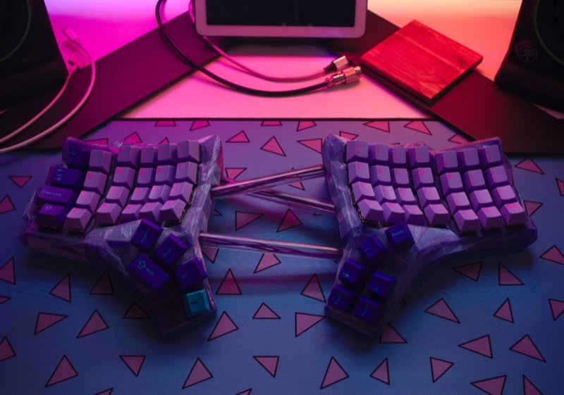 Left half of the finished vaporwave Dactyl Manuform on the desk