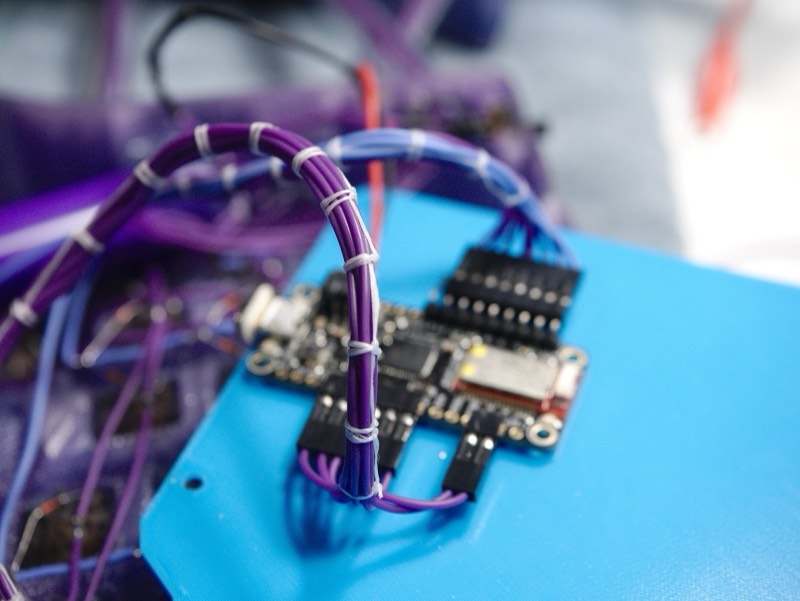 Macro shot of the controller PCB and wire lacing